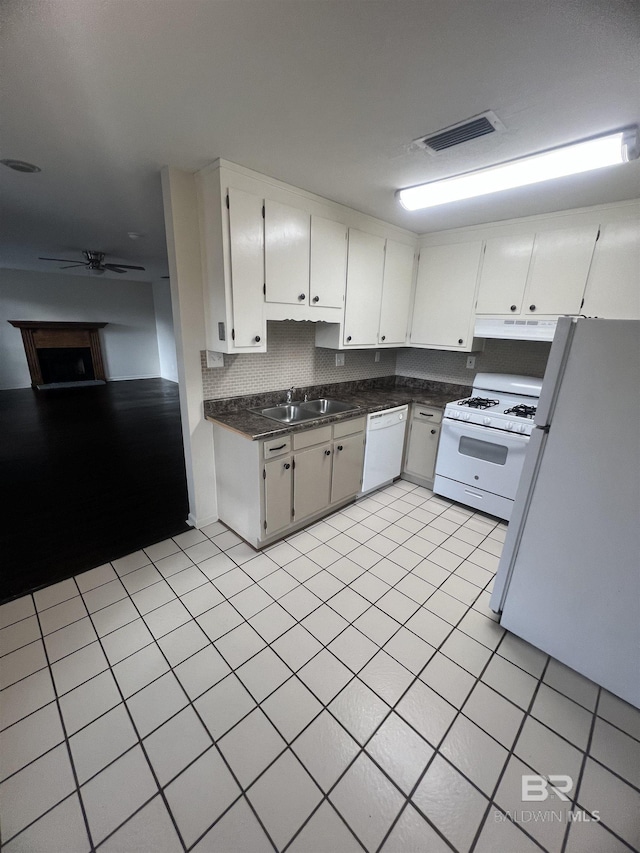 kitchen featuring sink, white appliances, ceiling fan, white cabinetry, and decorative backsplash