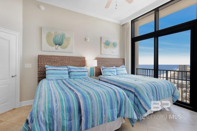 tiled bedroom with access to exterior, baseboards, ceiling fan, a water view, and ornamental molding