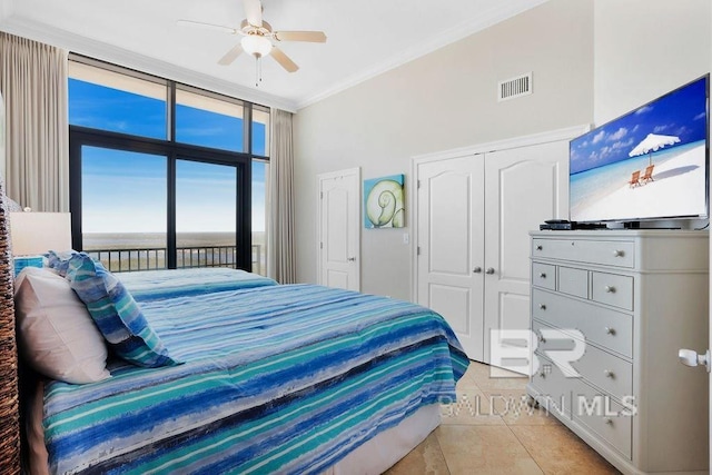 bedroom featuring access to exterior, visible vents, crown molding, floor to ceiling windows, and light tile patterned flooring