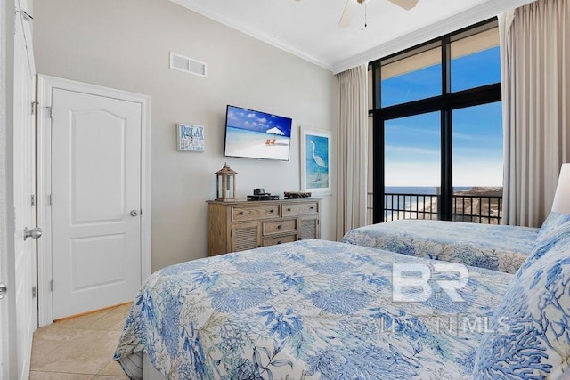 bedroom featuring visible vents, a wall of windows, ornamental molding, access to outside, and light tile patterned floors