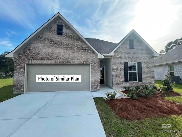 1582 Fenton Cir, Foley, AL 36535 - view of front of property with brick siding, concrete driveway, an attached garage, and central air condition unit