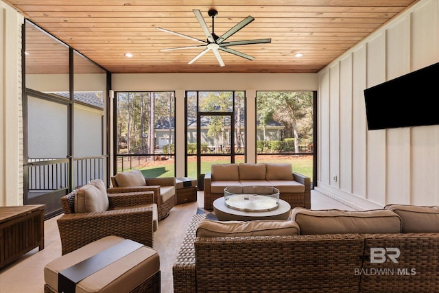 sunroom / solarium with wooden ceiling and a ceiling fan