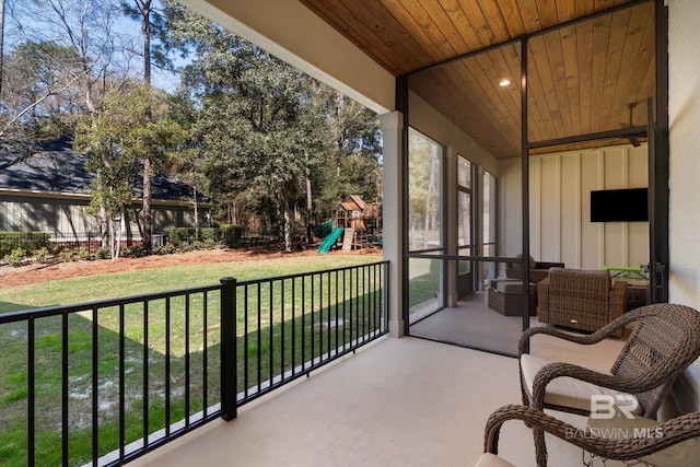 sunroom / solarium featuring wood ceiling