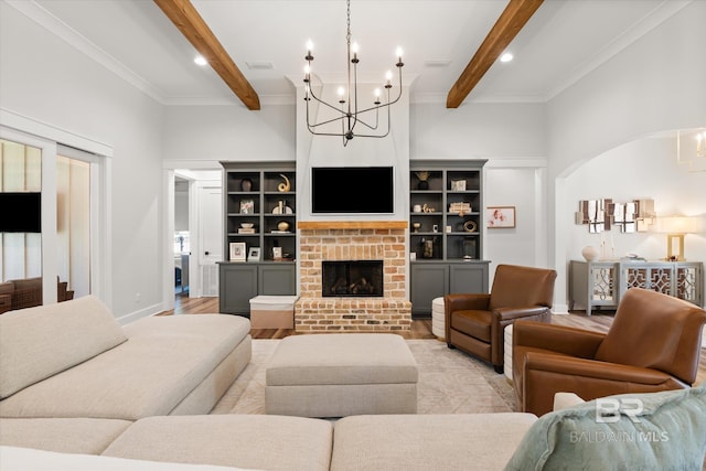 living area with baseboards, light wood finished floors, beam ceiling, a fireplace, and arched walkways