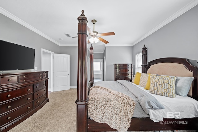 carpeted bedroom with crown molding and ceiling fan