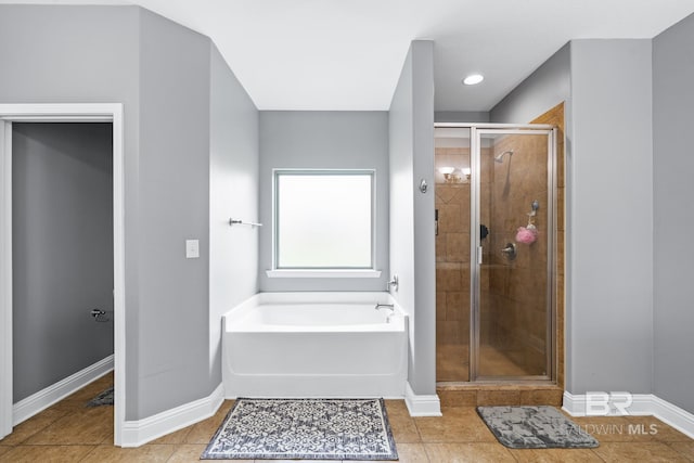 bathroom with tile patterned flooring and plus walk in shower