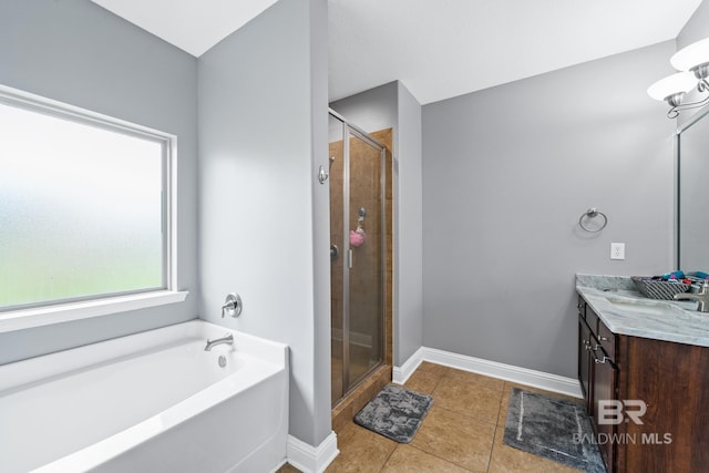 bathroom featuring vanity, plus walk in shower, and tile patterned flooring