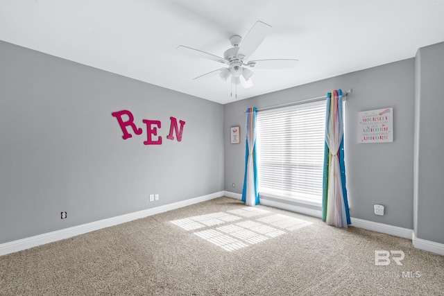 carpeted empty room with ceiling fan