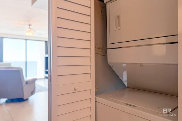 laundry area with stacked washer / dryer