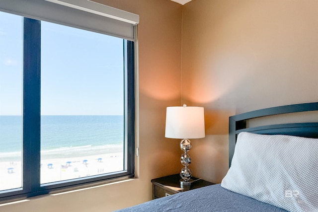 bedroom featuring a water view