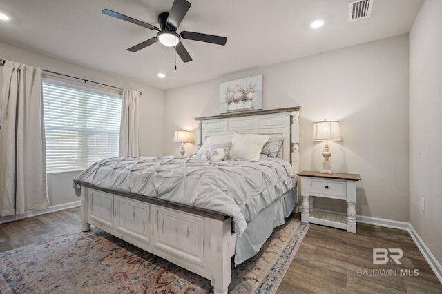 bedroom featuring ceiling fan and dark hardwood / wood-style flooring