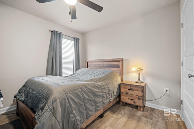 bedroom featuring ceiling fan and light hardwood / wood-style floors