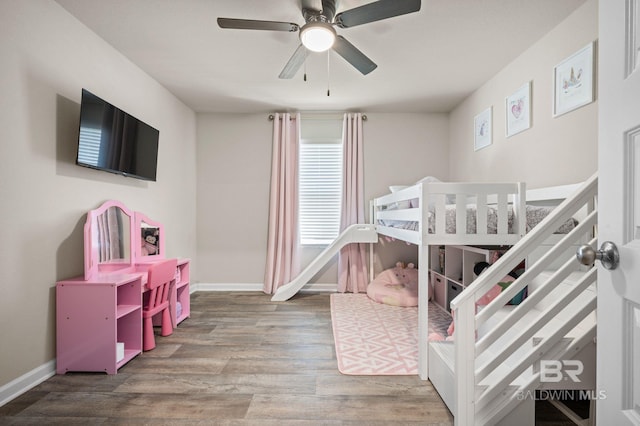 bedroom featuring ceiling fan and hardwood / wood-style flooring