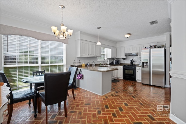 6417 Magnolia Place Ct, Mobile, AL 36695 - kitchen featuring appliances with stainless steel finishes, a peninsula, under cabinet range hood, brick floors, and a sink