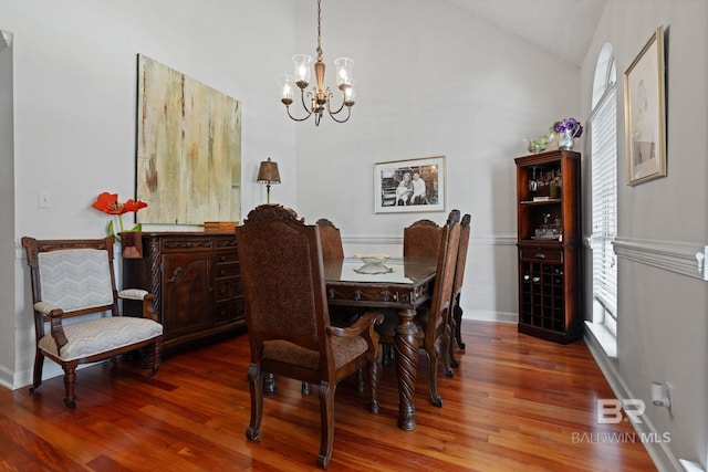 6417 Magnolia Place Ct, Mobile, AL 36695 - dining area with a chandelier, wood finished floors, vaulted ceiling, and baseboards