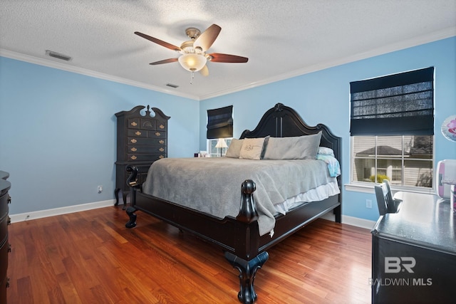 6417 Magnolia Place Ct, Mobile, AL 36695 - bedroom with wood finished floors, crown molding, a textured ceiling, ceiling fan, and baseboards