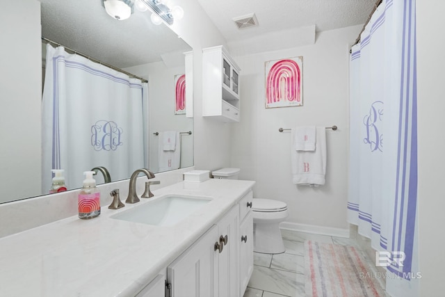 6417 Magnolia Place Ct, Mobile, AL 36695 - full bath with a textured ceiling, vanity, toilet, marble look tile flooring, and baseboards