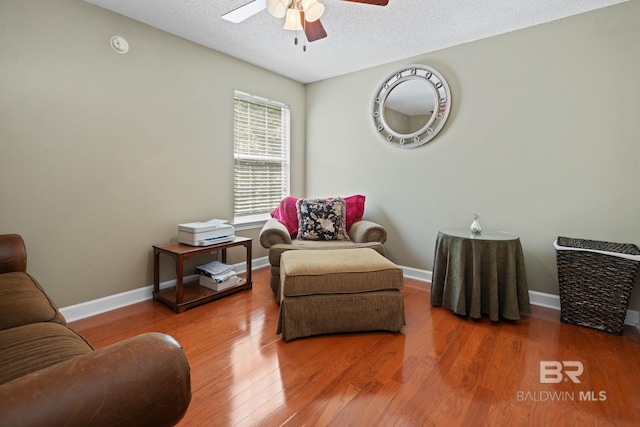 6417 Magnolia Place Ct, Mobile, AL 36695 - sitting room featuring a ceiling fan, wood finished floors, baseboards, and a textured ceiling