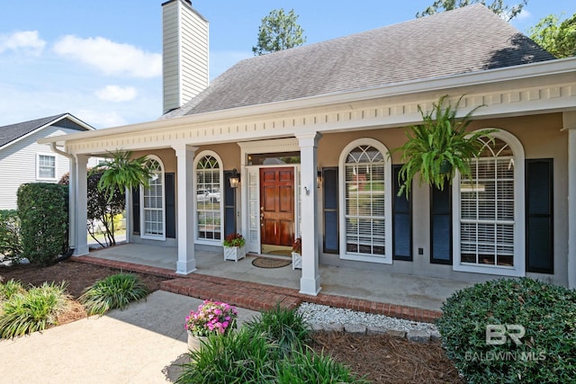 6417 Magnolia Place Ct, Mobile, AL 36695 - doorway to property with a porch, a chimney, and a shingled roof