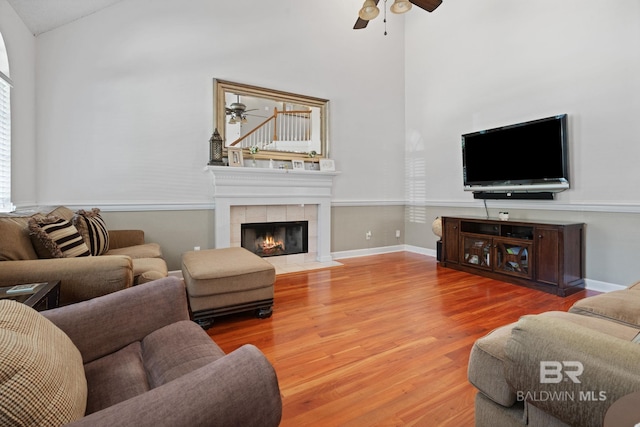 6417 Magnolia Place Ct, Mobile, AL 36695 - living area featuring a ceiling fan, wood finished floors, a tiled fireplace, and lofted ceiling