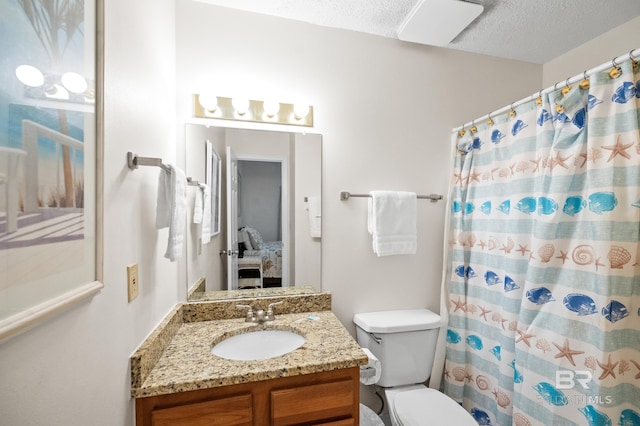 bathroom featuring a shower with shower curtain, toilet, vanity, ensuite bath, and a textured ceiling