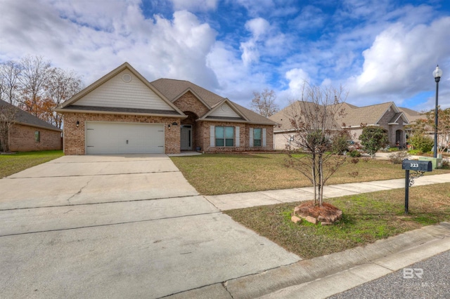 view of front of home featuring a front yard and a garage