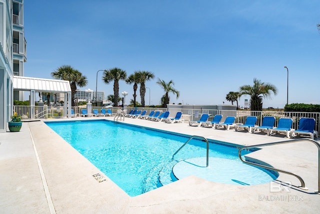 view of swimming pool featuring a patio