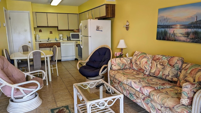 tiled living room featuring sink