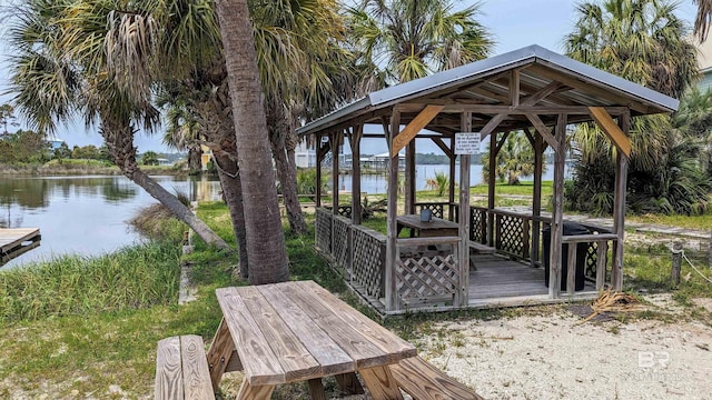 exterior space featuring a gazebo and a water view