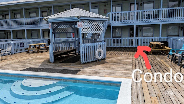 view of pool featuring a wooden deck