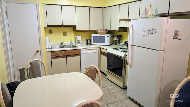 kitchen with sink, ventilation hood, white cabinets, white appliances, and light tile patterned floors