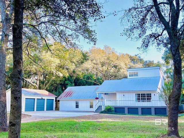 19744 County Road 9, Silverhill, AL 36576 - view of front of home with a garage, a front lawn, and an outdoor structure