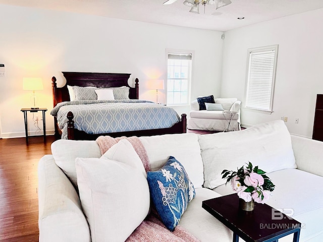 bedroom with hardwood / wood-style floors and ceiling fan