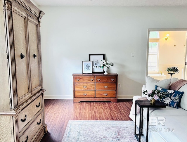 bedroom featuring a textured ceiling and dark wood-type flooring