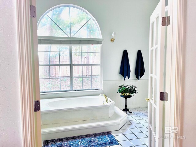 19744 County Road 9, Silverhill, AL 36576 - bathroom featuring tile patterned flooring and a tub to relax in