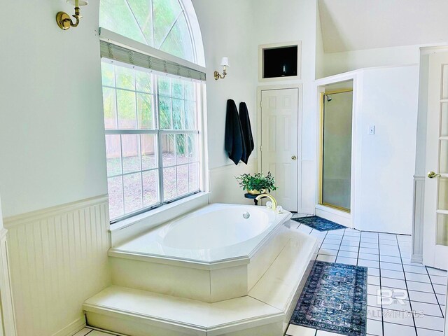 19744 County Road 9, Silverhill, AL 36576 - bathroom with tile patterned floors, lofted ceiling, and shower with separate bathtub