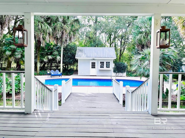 view of pool featuring an outbuilding