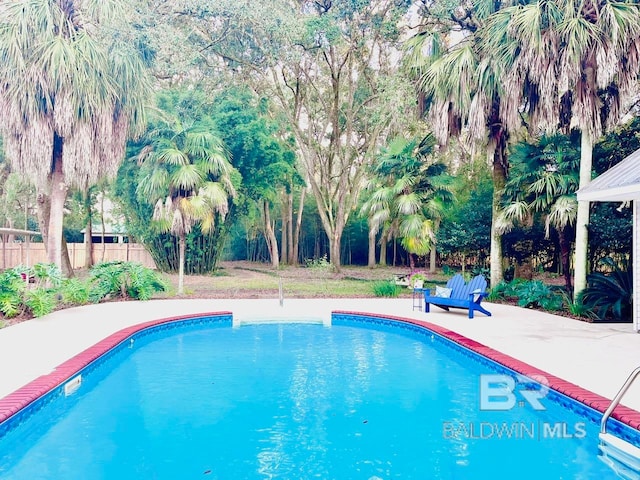 view of pool featuring a patio area