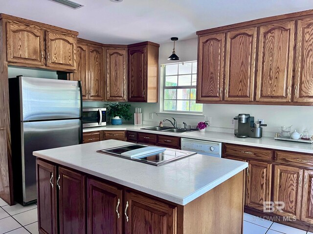 19744 County Road 9, Silverhill, AL 36576 - kitchen with sink, hanging light fixtures, stainless steel appliances, light tile patterned floors, and a kitchen island