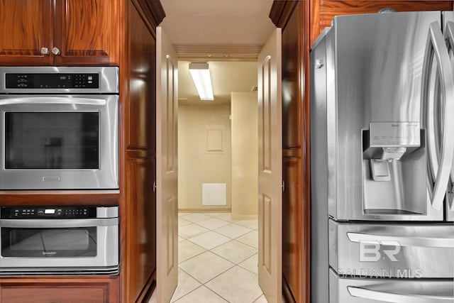 28452 Ono Blvd, Orange Beach, AL 36561 - kitchen featuring appliances with stainless steel finishes and light tile patterned floors