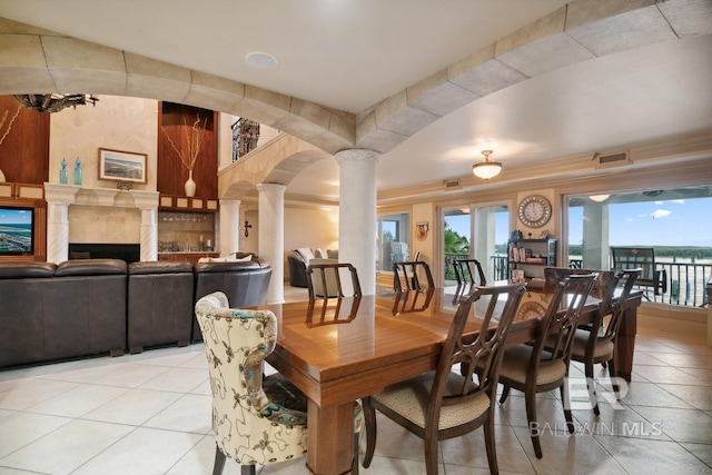 28452 Ono Blvd, Orange Beach, AL 36561 - dining space featuring decorative columns and light tile patterned floors