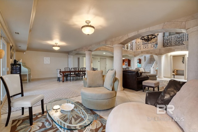 28452 Ono Blvd, Orange Beach, AL 36561 - tiled living area with decorative columns, crown molding, and arched walkways