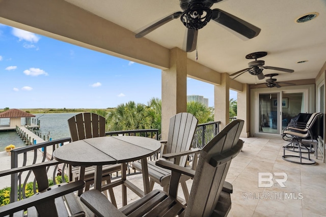 28452 Ono Blvd, Orange Beach, AL 36561 - patio / terrace with a ceiling fan, a water view, and outdoor dining area