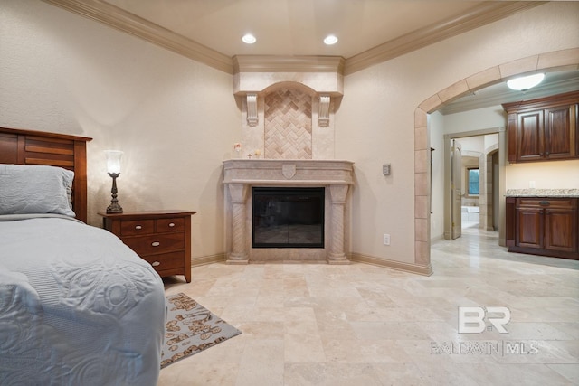 28452 Ono Blvd, Orange Beach, AL 36561 - bedroom with ornamental molding, arched walkways, a premium fireplace, and recessed lighting