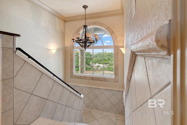 28452 Ono Blvd, Orange Beach, AL 36561 - staircase featuring a chandelier and crown molding
