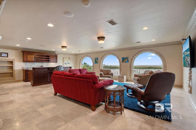 28452 Ono Blvd, Orange Beach, AL 36561 - living area with ornamental molding, wet bar, and recessed lighting