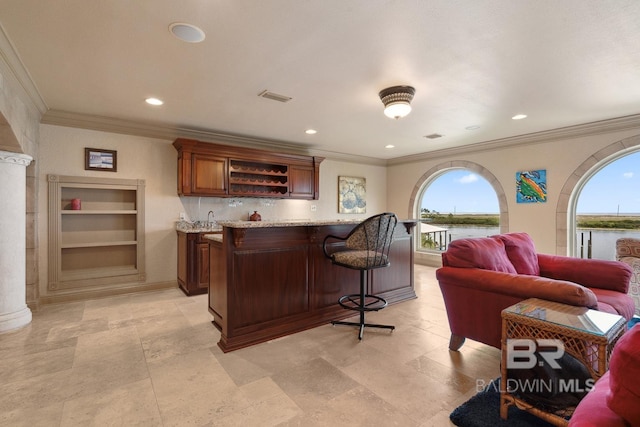 28452 Ono Blvd, Orange Beach, AL 36561 - indoor wet bar featuring healthy amount of natural light, ornamental molding, a water view, recessed lighting, and built in features