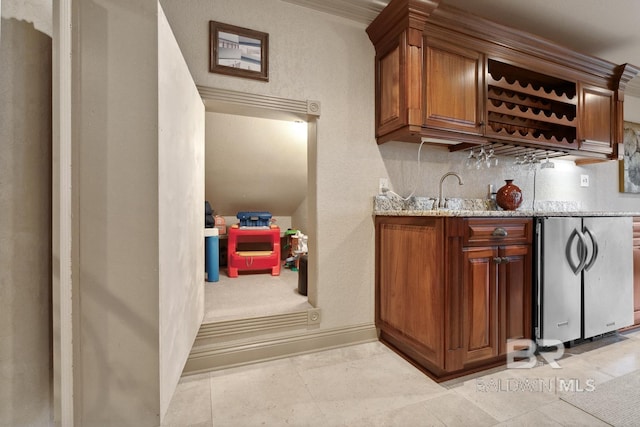 28452 Ono Blvd, Orange Beach, AL 36561 - indoor wet bar featuring stainless steel fridge and baseboards