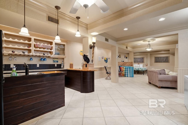 28452 Ono Blvd, Orange Beach, AL 36561 - bar area with crown molding, pendant lighting, light tile patterned floors, wainscoting, and ceiling fan