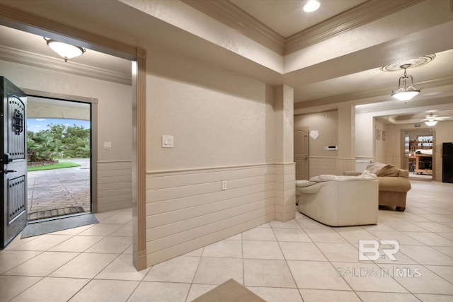 28452 Ono Blvd, Orange Beach, AL 36561 - foyer entrance with ornamental molding, light tile patterned floors, wainscoting, and a ceiling fan